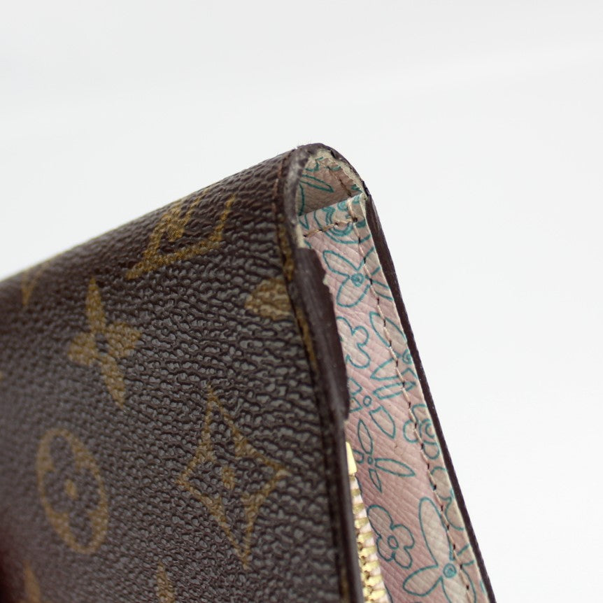 I kove the Louis Vuitton Insolite wallet. It has 12 credit card slots