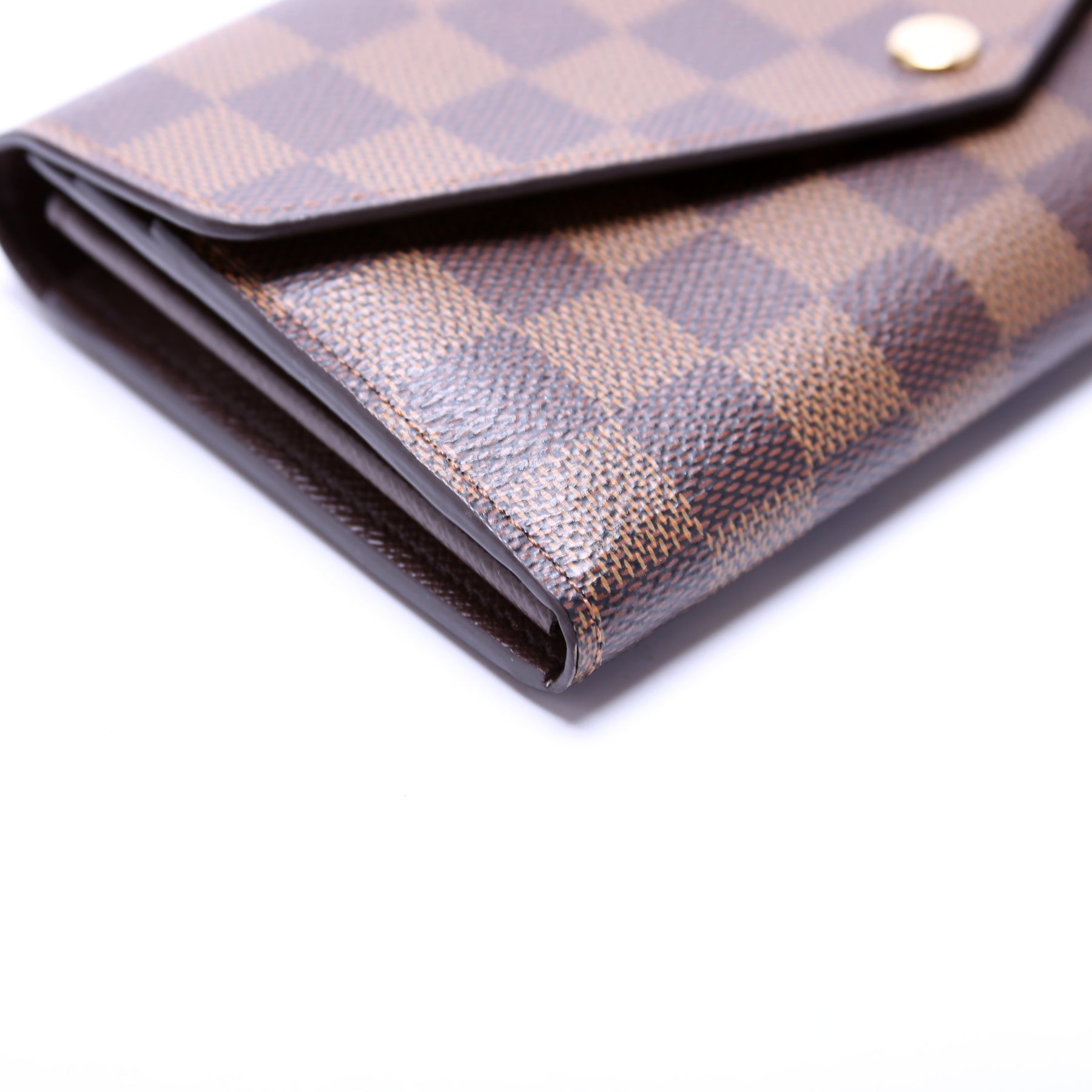 Discover Louis Vuitton Sarah Wallet: This envelope-style Sarah wallet  combines an elegant exterior in Damier Eb…