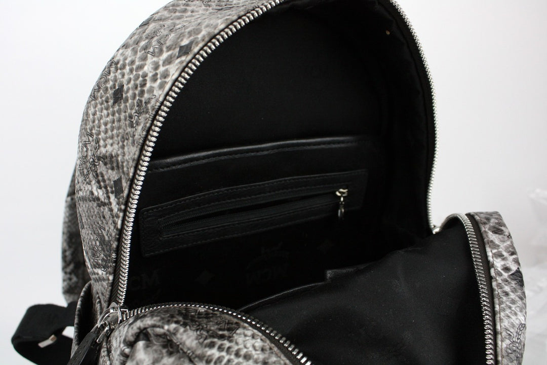 black leather snakeskin panel backpack MCM Stark Classic Backpack in Snakeskin Print